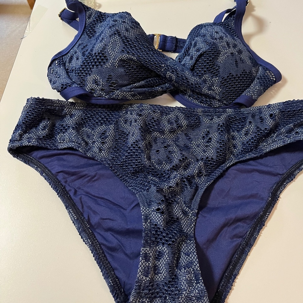 Athena bikini twisted front top with crochet overlay .